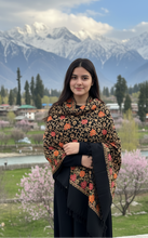 Load image into Gallery viewer, Woman in traditional attire standing in front of mountainous landscape