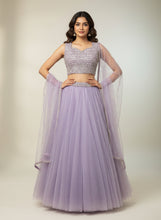 Load image into Gallery viewer, Purple two-piece dress on a mannequin in a store window.