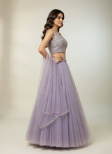 Load image into Gallery viewer, Woman wearing a lavender traditional outfit with a matching dupatta on a neutral background