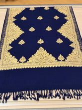 Load image into Gallery viewer, Blue fabric with gold embroidery on a wooden surface
