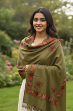 Load image into Gallery viewer, Woman wearing an embroidered green shawl in a garden setting
