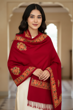 Load image into Gallery viewer, Woman wearing a red embroidered shawl in an indoor setting
