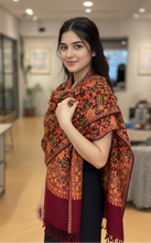Load image into Gallery viewer, Woman wearing a patterned scarf in an indoor setting
